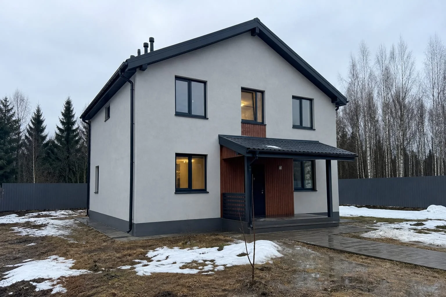 Двухэтажный СИП-дом площадью 128 м² зимой